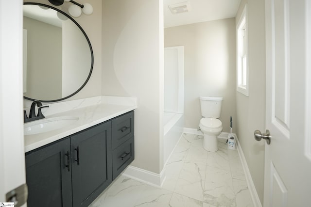 bathroom with vanity and toilet