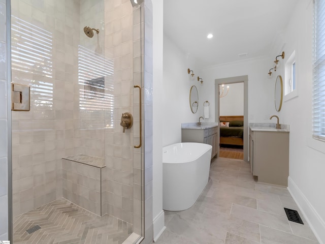 bathroom featuring vanity and separate shower and tub