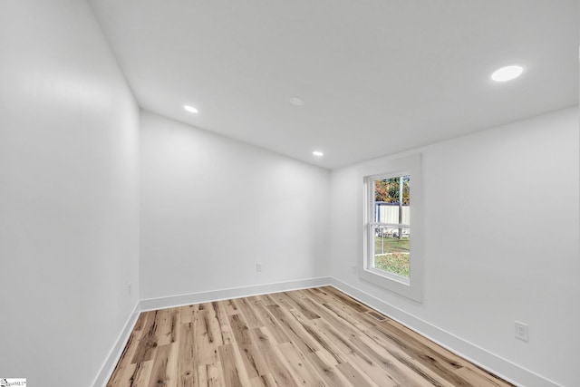 unfurnished room featuring light hardwood / wood-style flooring