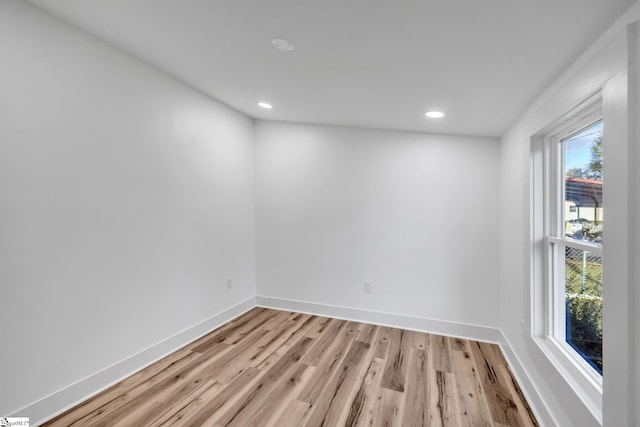 unfurnished room featuring light hardwood / wood-style floors