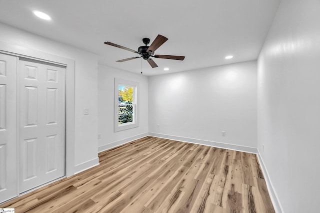 interior space with light wood-type flooring and ceiling fan