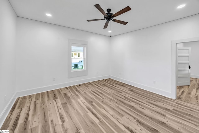 spare room featuring ceiling fan and light hardwood / wood-style floors