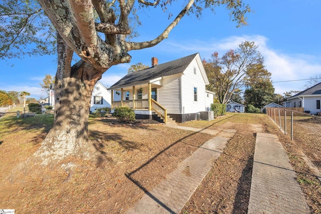 view of home's exterior featuring central AC and covered porch