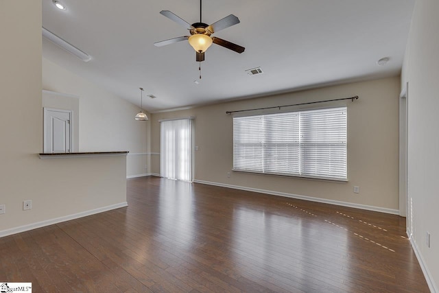 unfurnished living room featuring ceiling fan, dark hardwood / wood-style flooring, and lofted ceiling