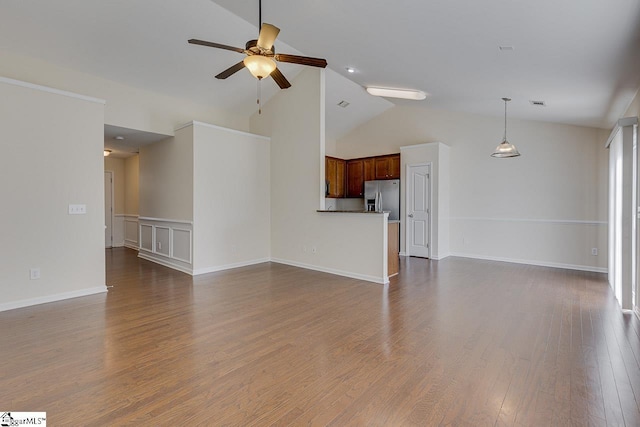 unfurnished living room with ceiling fan, dark wood-type flooring, and high vaulted ceiling