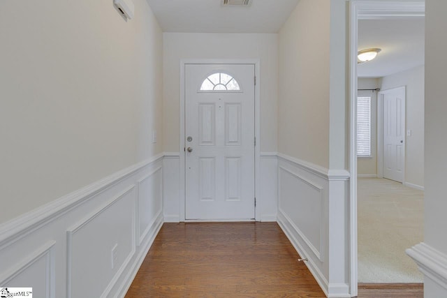 doorway to outside with hardwood / wood-style flooring