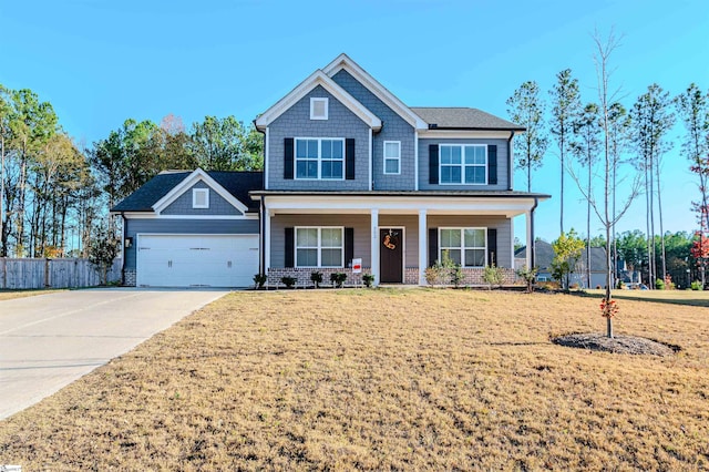 craftsman-style house with a porch, a front yard, and a garage