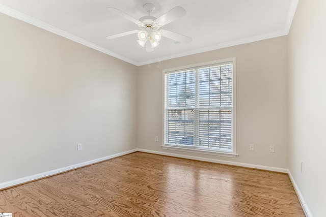 unfurnished room with ceiling fan, a healthy amount of sunlight, light hardwood / wood-style floors, and ornamental molding