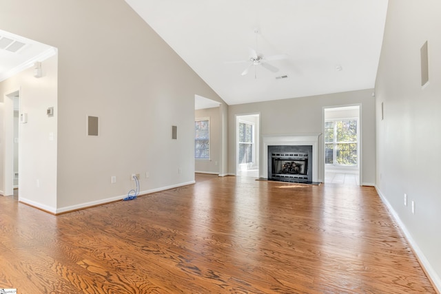 unfurnished living room featuring ceiling fan, high vaulted ceiling, and hardwood / wood-style flooring