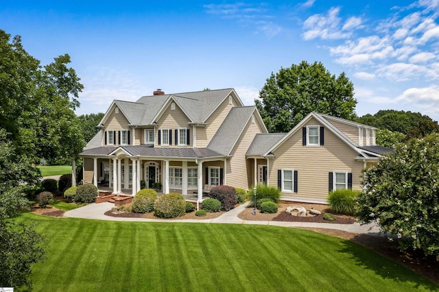 view of front facade with a front lawn and a porch