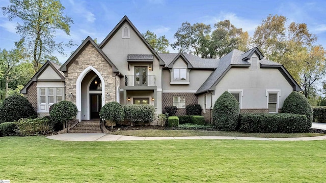 tudor house with a balcony and a front lawn