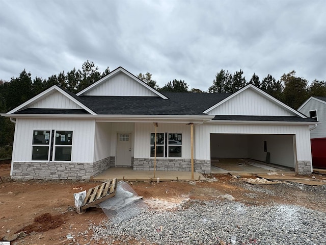 view of front of house with a porch and a garage