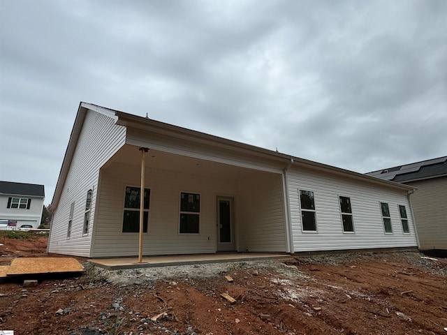 rear view of property featuring a patio area