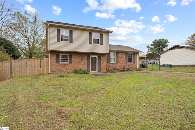 view of front of property featuring a front yard and a carport