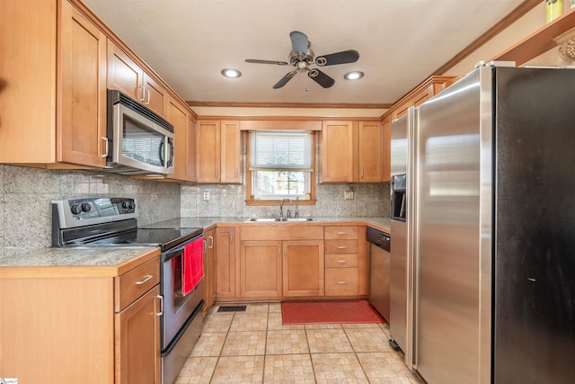 kitchen with appliances with stainless steel finishes, backsplash, crown molding, sink, and light tile patterned floors