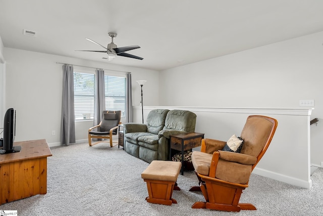 living room featuring ceiling fan and light carpet