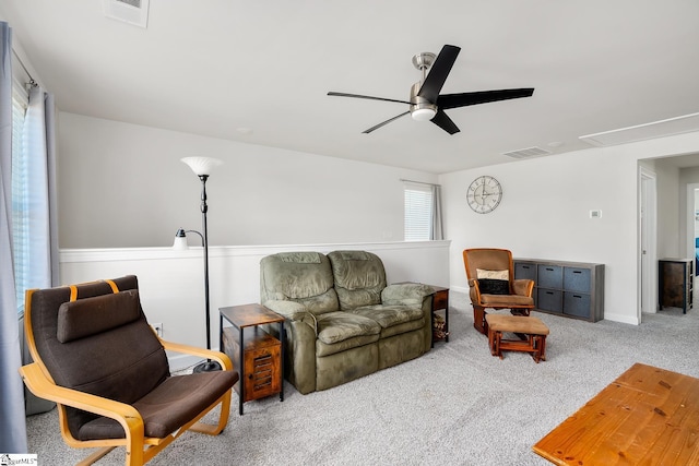 living room featuring ceiling fan and light colored carpet