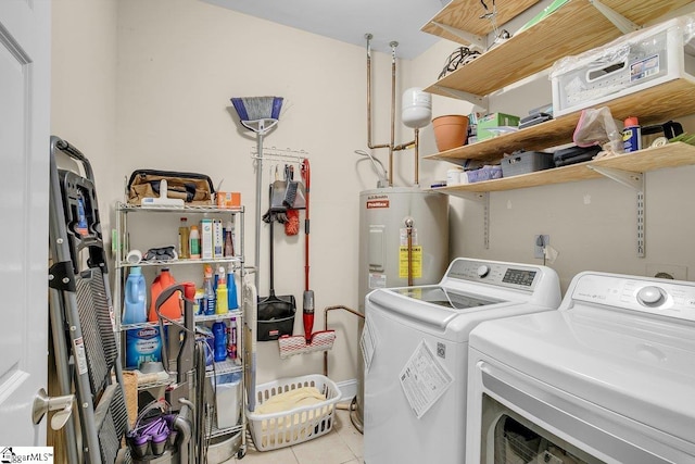 laundry room featuring separate washer and dryer, electric water heater, and light tile patterned floors