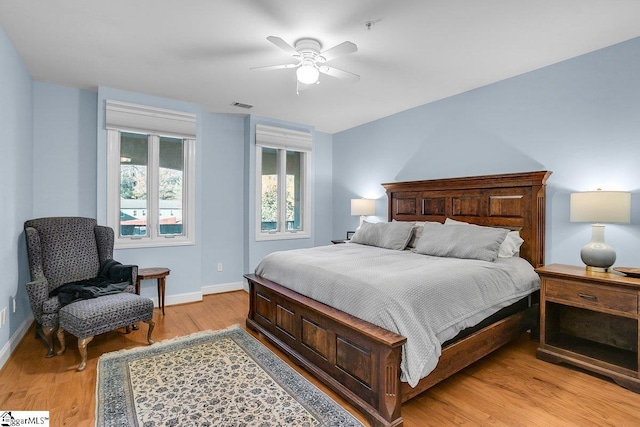 bedroom with ceiling fan and light hardwood / wood-style flooring