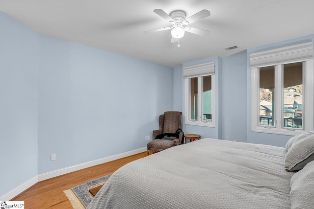 bedroom featuring ceiling fan and light hardwood / wood-style flooring