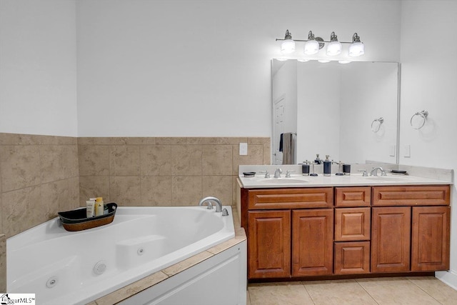 bathroom with tile patterned flooring, vanity, and a bathing tub