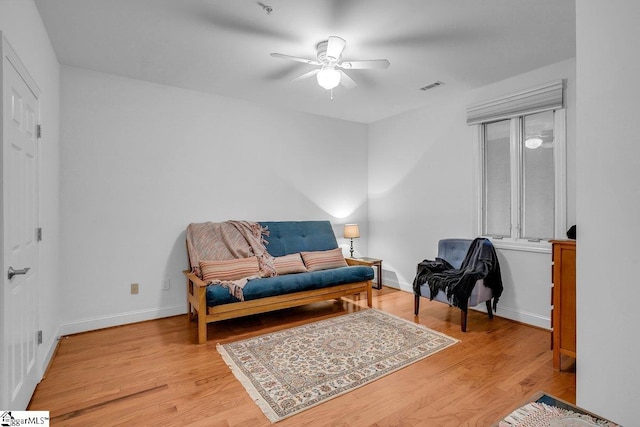 sitting room featuring ceiling fan and light hardwood / wood-style flooring