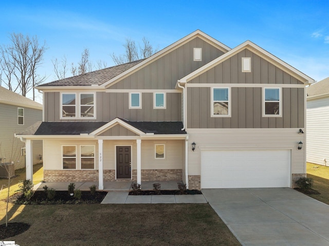 craftsman house with central AC unit and a garage