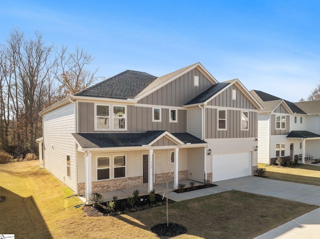 view of front facade featuring a front lawn and a garage