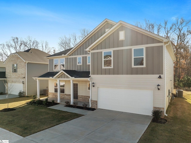 craftsman-style home featuring a front yard, a garage, and cooling unit