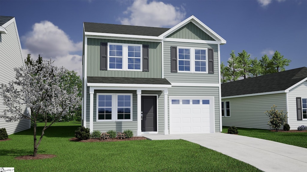 view of front of house with a garage and a front yard