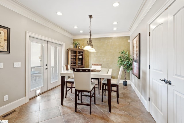 dining space featuring crown molding and french doors