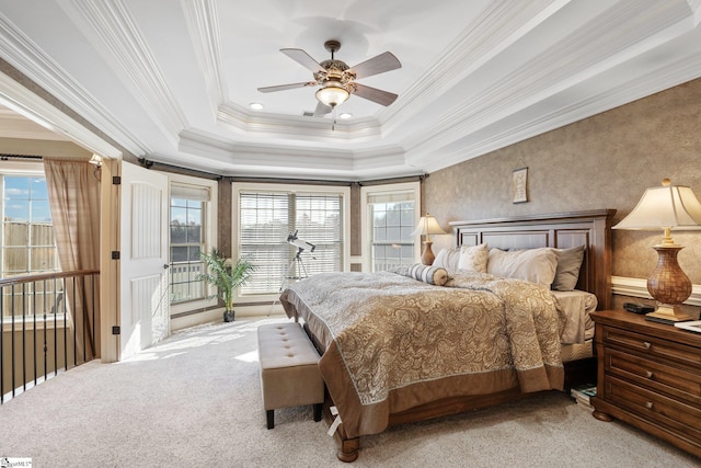 carpeted bedroom featuring multiple windows, crown molding, and ceiling fan