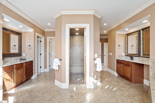 bathroom with tiled shower, vanity, tile patterned floors, and crown molding