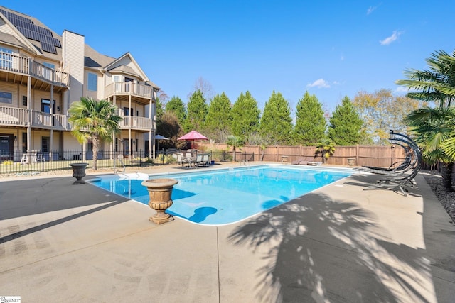 view of swimming pool with a patio