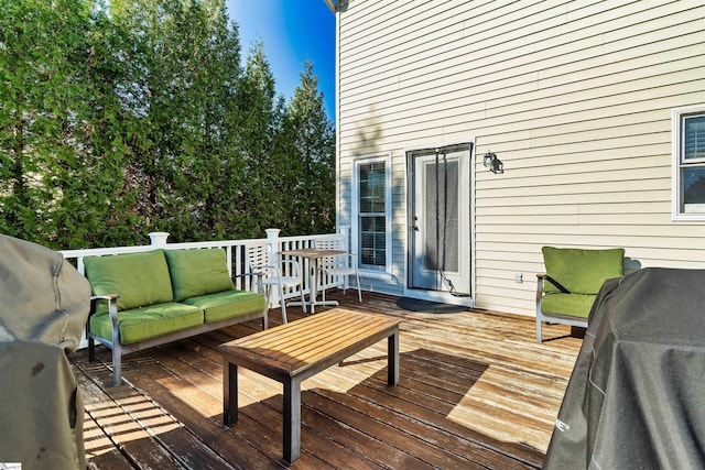 wooden deck featuring an outdoor hangout area