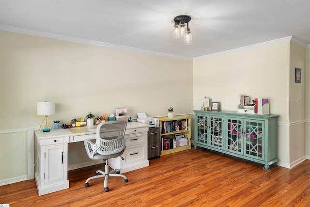 home office with hardwood / wood-style flooring and ornamental molding