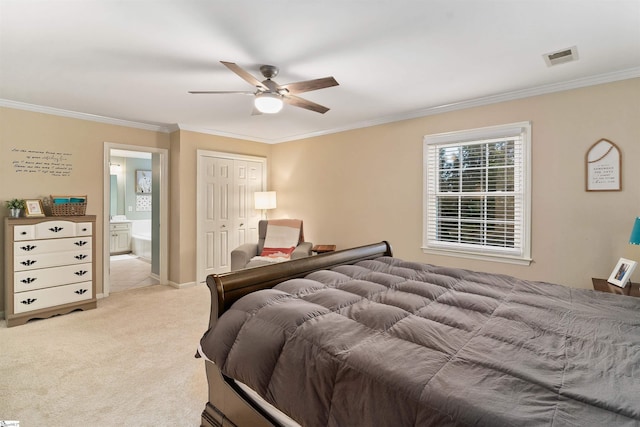 carpeted bedroom featuring a closet, ceiling fan, ornamental molding, and ensuite bathroom