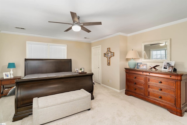 carpeted bedroom featuring ceiling fan and crown molding