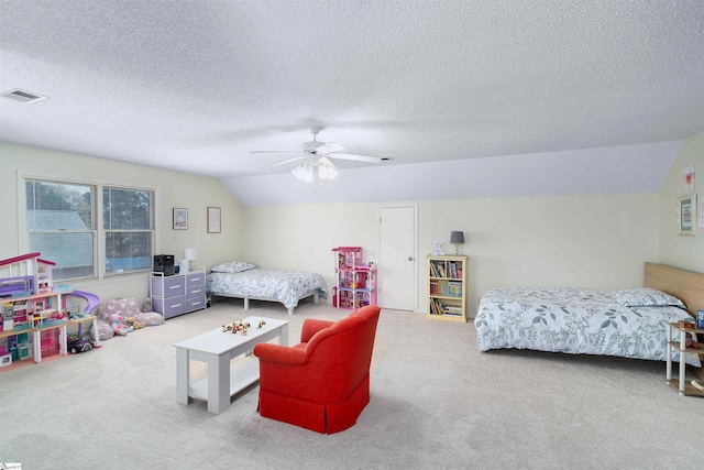 bedroom with a textured ceiling, light colored carpet, ceiling fan, and lofted ceiling