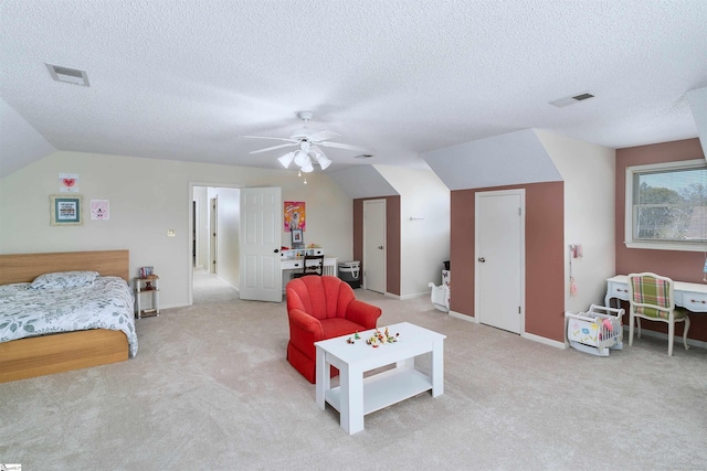 carpeted bedroom featuring a textured ceiling, ceiling fan, and lofted ceiling