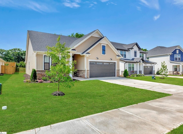 view of front of property featuring a garage and a front lawn