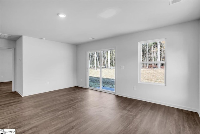 empty room featuring dark wood-type flooring