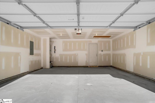 garage with electric panel and a garage door opener