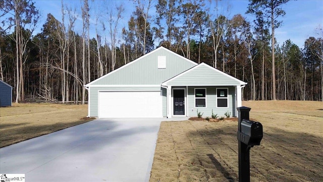 view of front of home featuring a garage and a front lawn