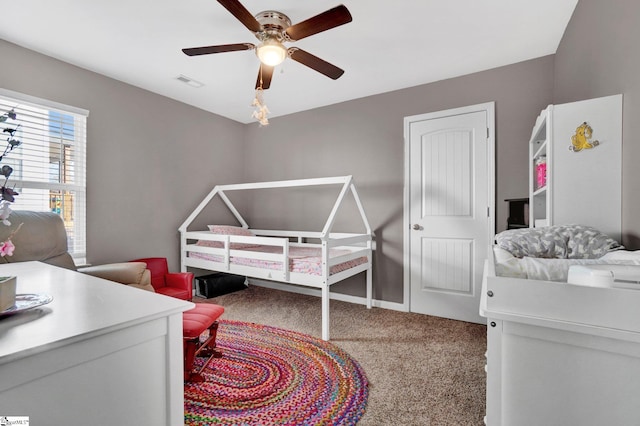 carpeted bedroom featuring ceiling fan