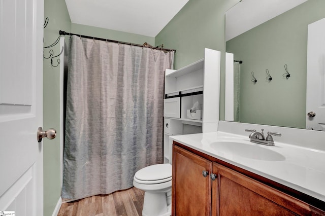 full bathroom featuring wood-type flooring, vanity, toilet, and shower / tub combo with curtain