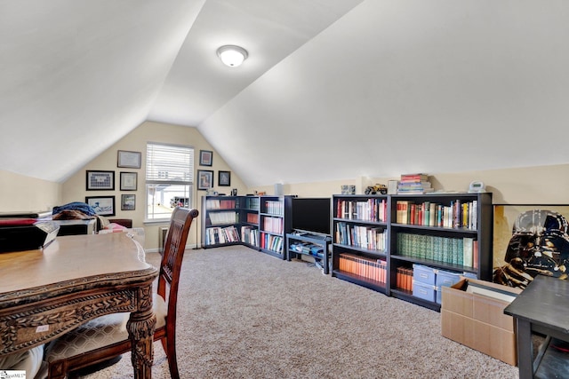 carpeted office space with lofted ceiling