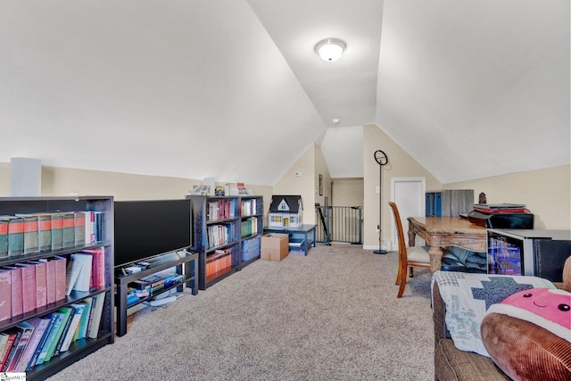 carpeted office featuring lofted ceiling