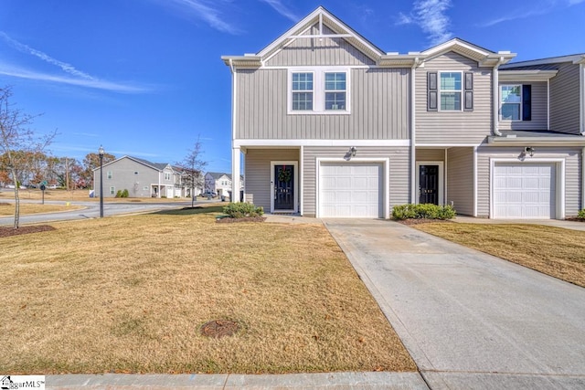 view of front of property featuring a garage and a front yard