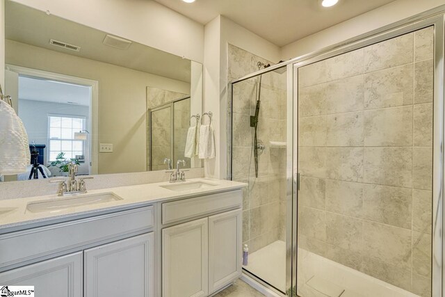 bathroom featuring vanity and walk in shower